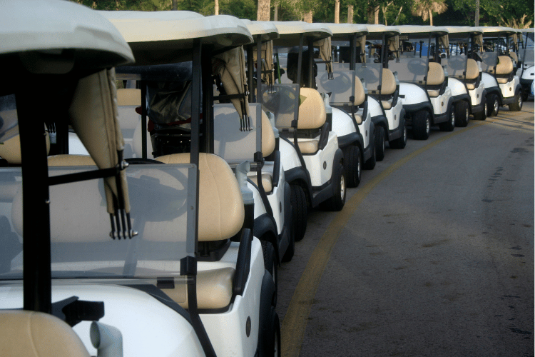 Production Transport Golf Carts Lined Up